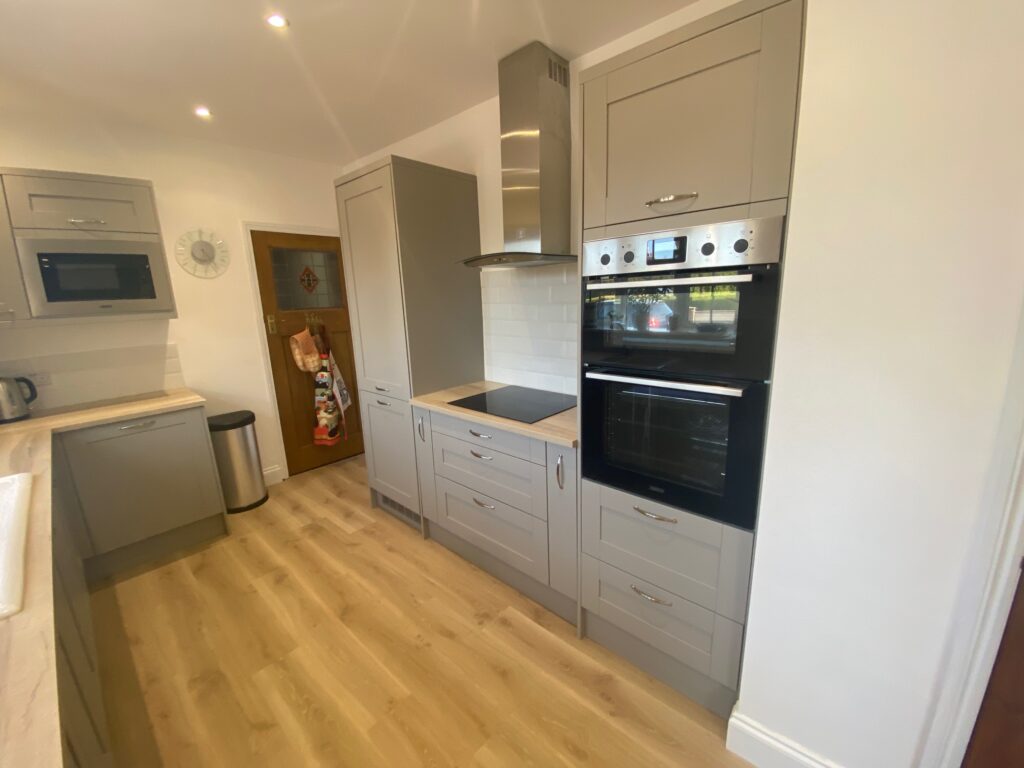 A brand new kitchen from Dymchurch Improvements with a brand new hob and extractor.