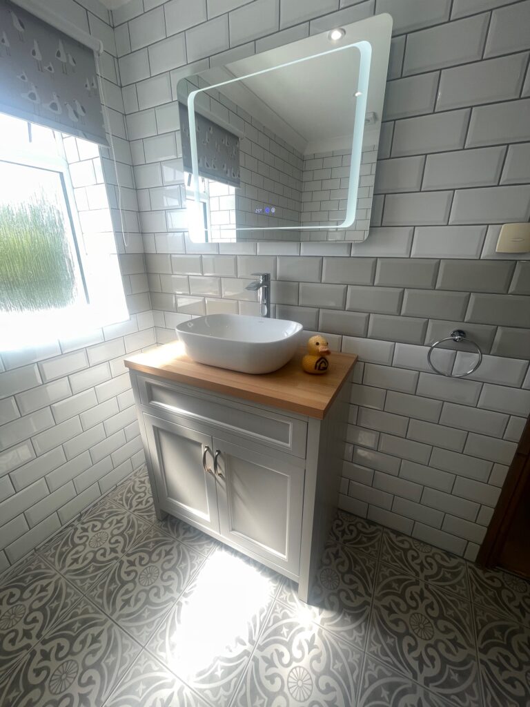 A brand new sink with storage cupboards in natural light from the en-suite project at Burmarsh from Dymchurch Improvements