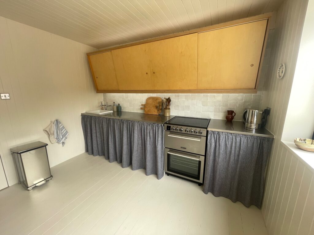 A large kitchen space with storage by Dymchurch Improvements