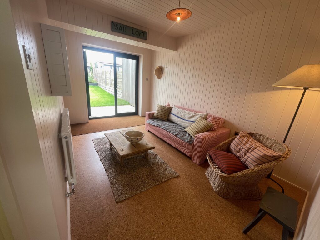 A view of the fitted sliding doors in this renovated living room by Dymchurch Improvements.