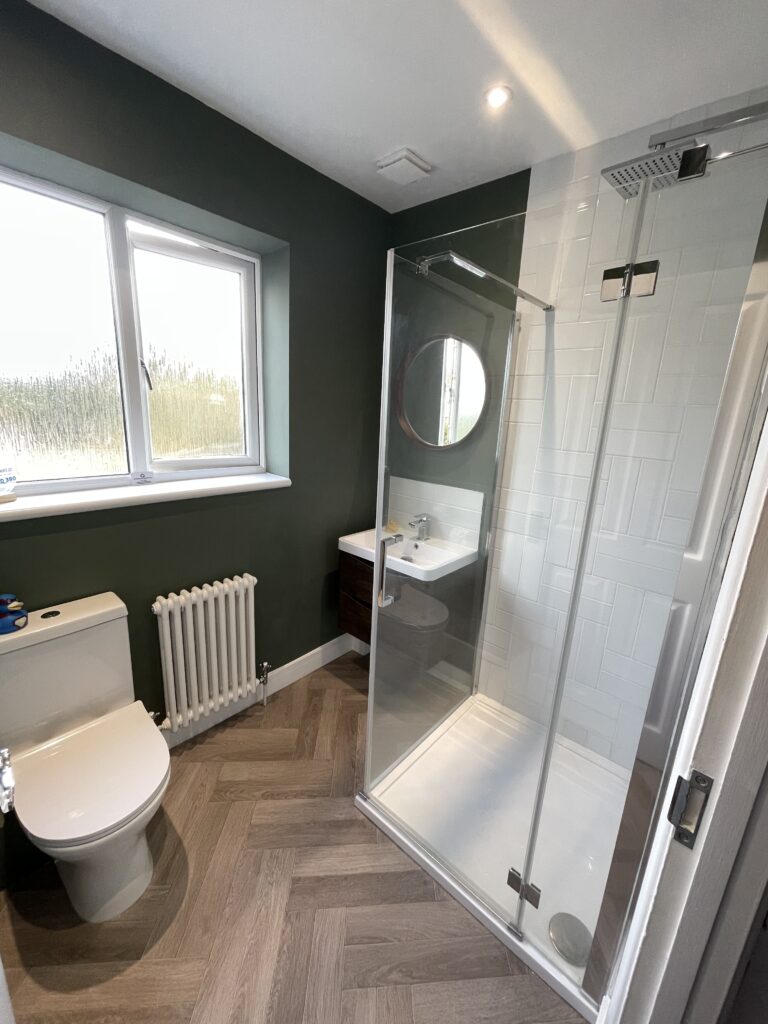 New shower, toilet and sink included in this bathroom renovation by Dymchurch Improvements.