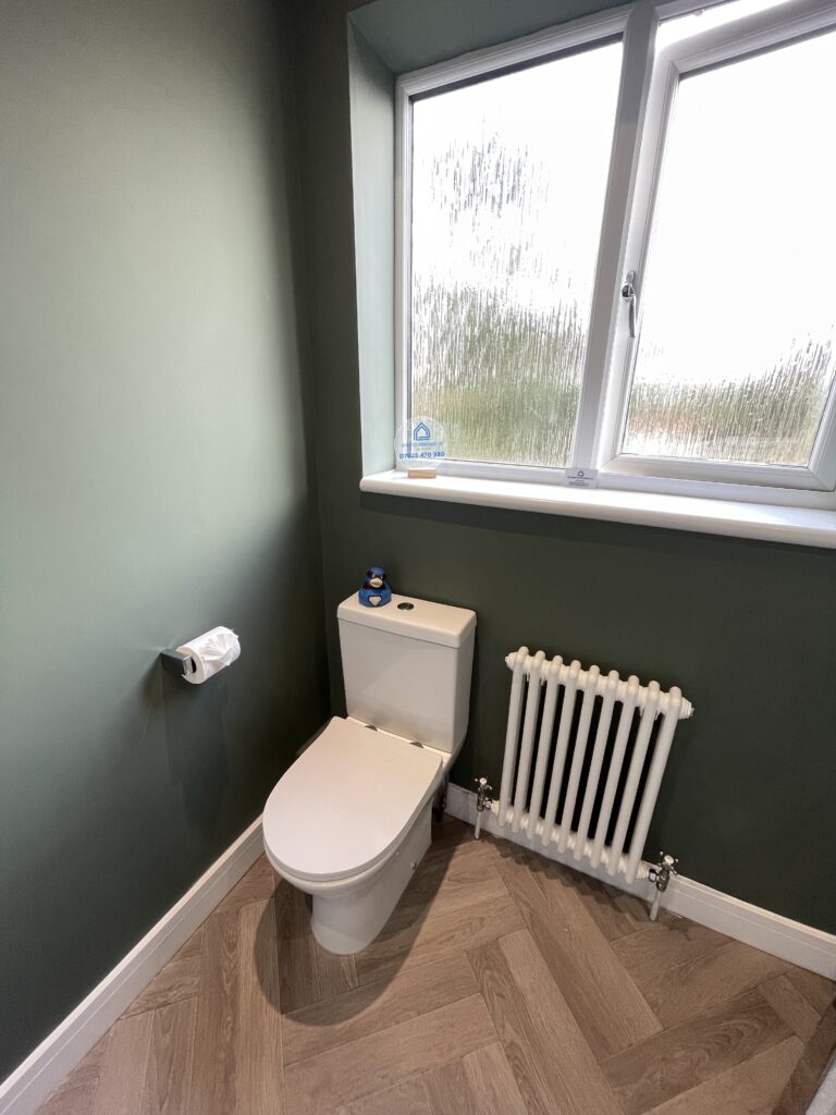 Brand new toilet with radiator fitted by Dymchurch Improvements